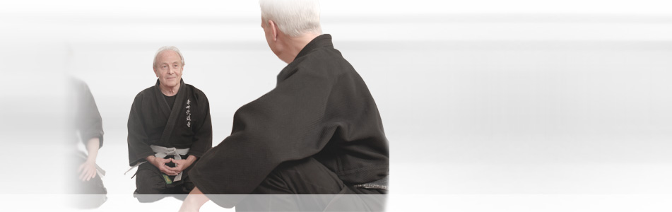 Two senior martial arts practitioners training at CAMA